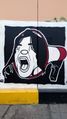 جرافيتي فتاة تصرخ من ميغافون.jpg